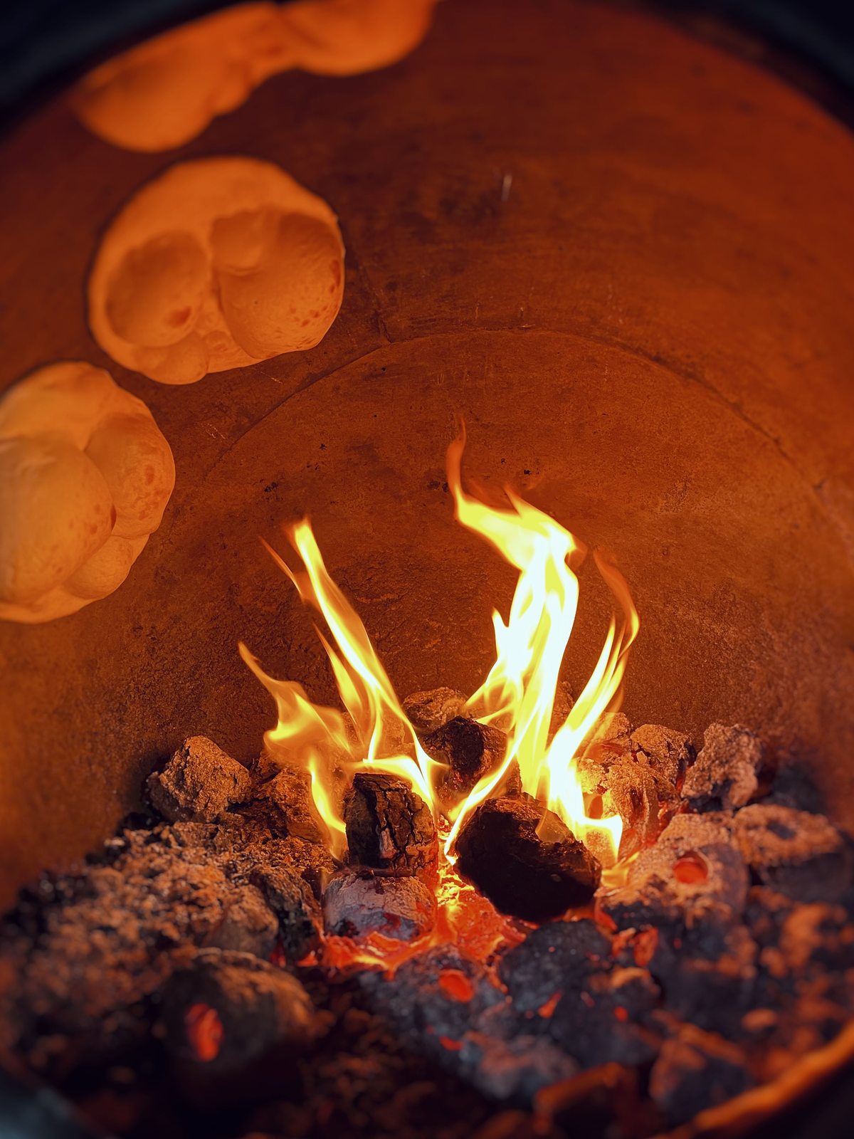 Wood-fired clay tandoor oven at Saffron Sips